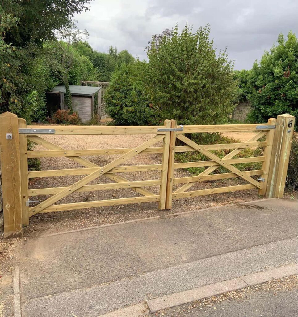 This is a photo of a wooden driveway gate installed by Fast Fix Fencing Longstanton